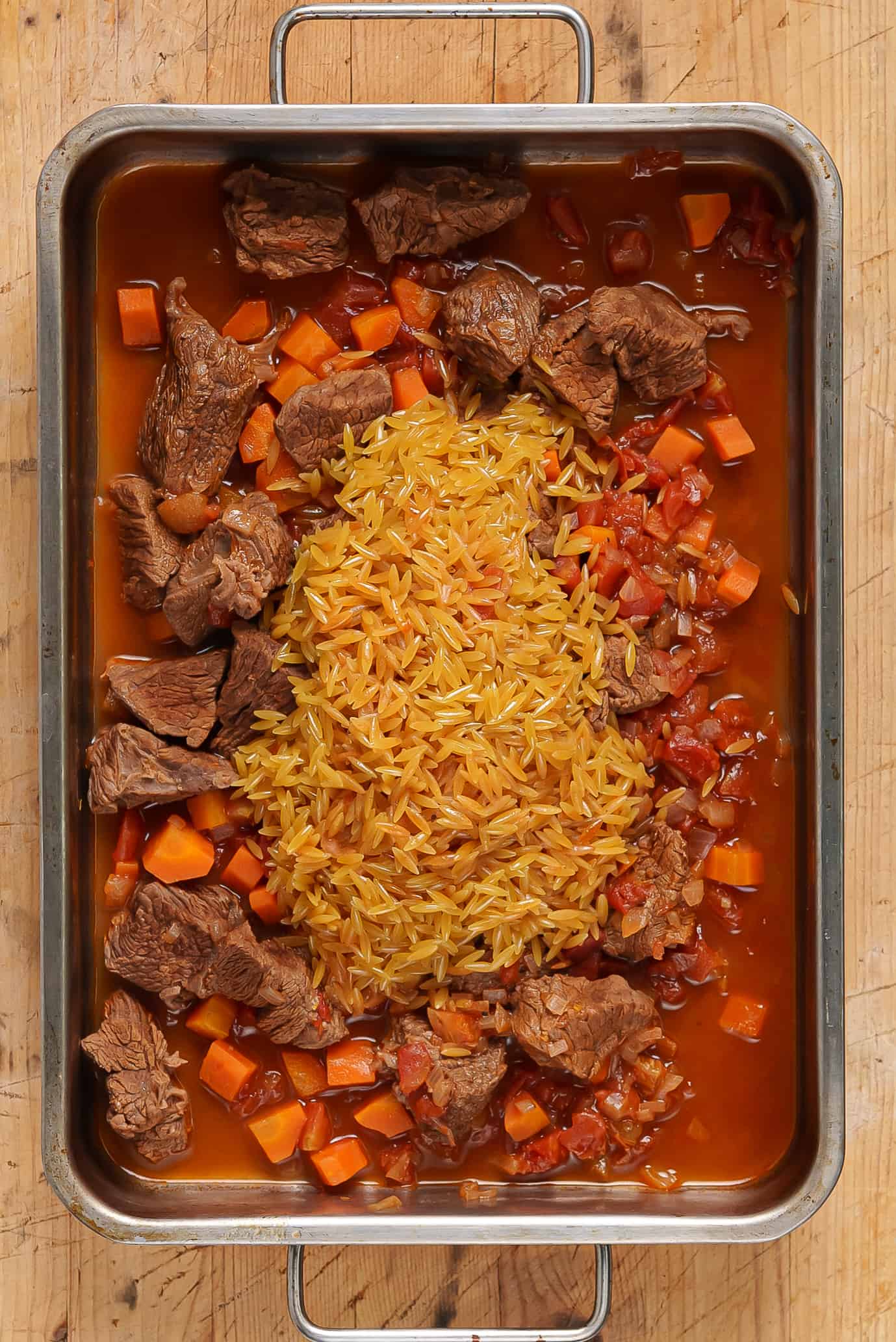 Giouvetsi preparation (Greek Beef stew with Orzo pasta)